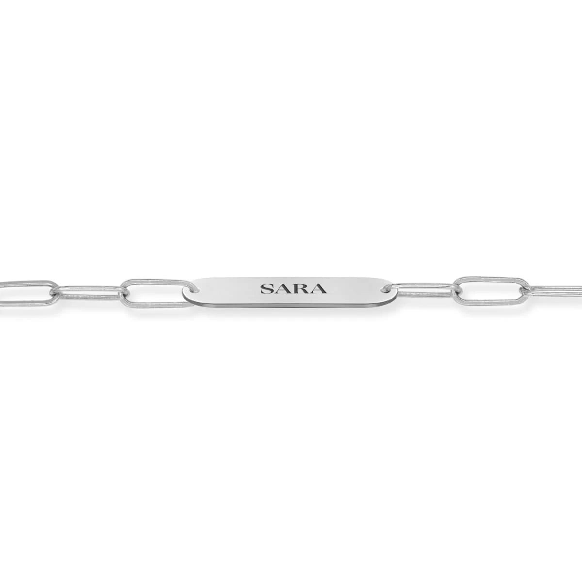 Close-up of 14k white gold nameplate engraved with "SARA" on Adelaide Mini chain.
