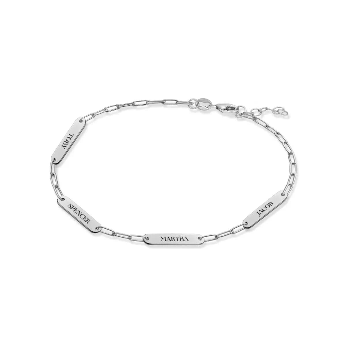 Custom 14k white gold bracelet engraved with the names Toby, Spencer, Martha, and Jacob on four petite flat nameplates.