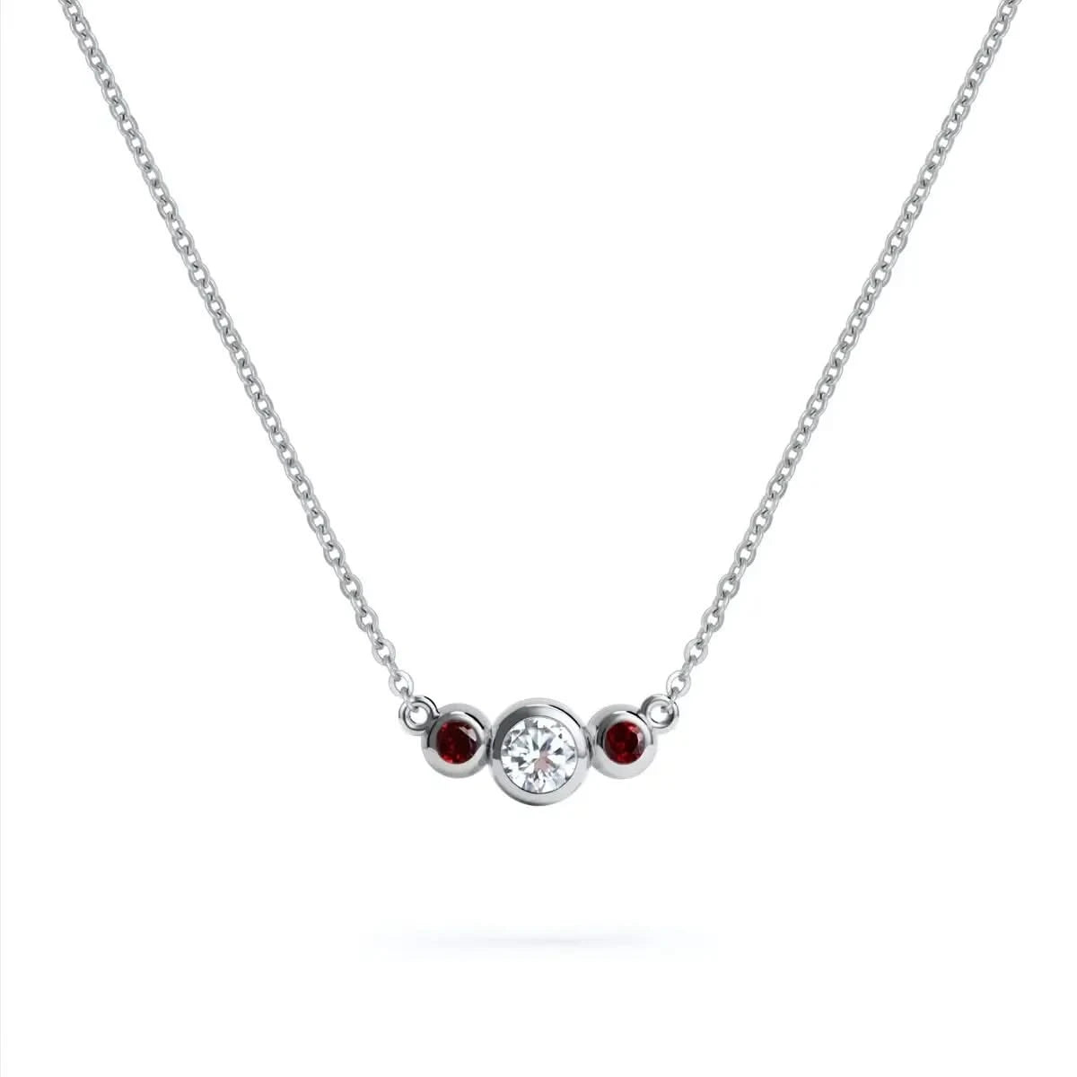 Barrington 3 Stone Necklace featuring a 4 mm round cut Diamond center stone framed by two 2 mm round cut Garnets bezel set in 14k white gold on a saffron chain – front view.