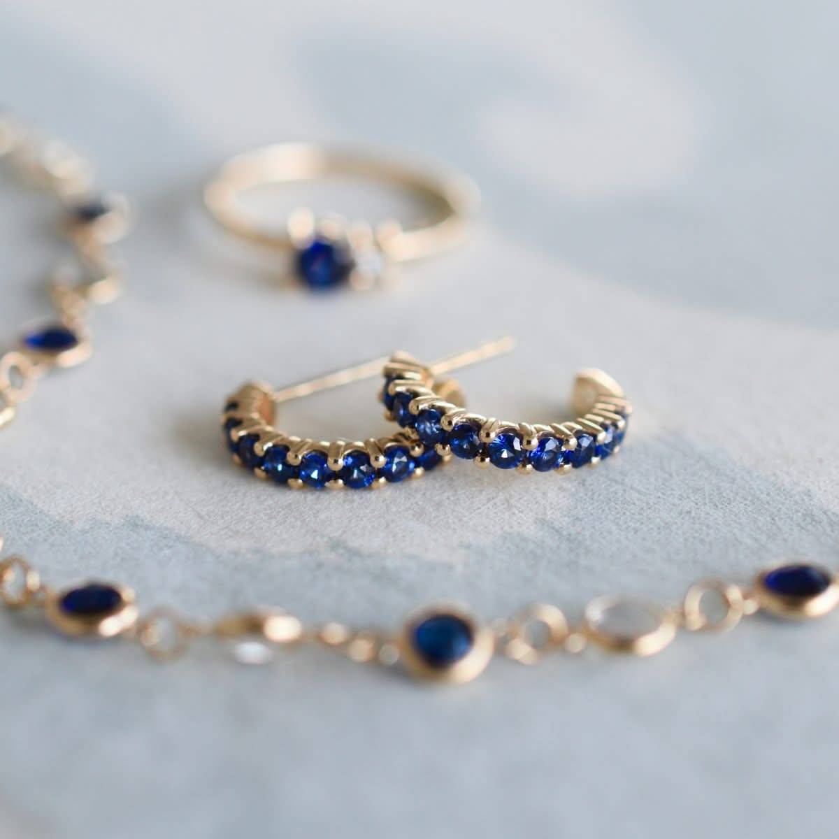 Rosecliff Sapphire Huggie Hoop Earrings in 14k Gold (September)