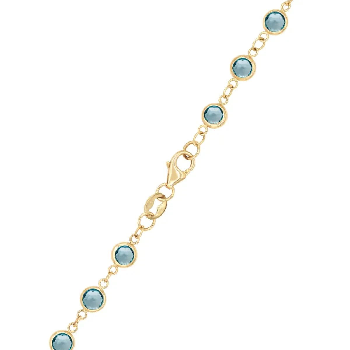 14k yellow gold 1.17 mm cable chain with a lobster claw clasp and 4 mm briolette cut bezel set blue topaz
