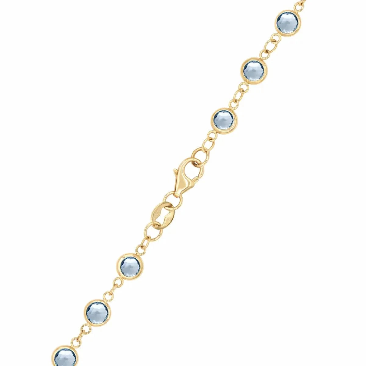 14k yellow gold 1.17 mm cable chain with a lobster claw clasp and 4 mm briolette cut bezel set Aquamarines.