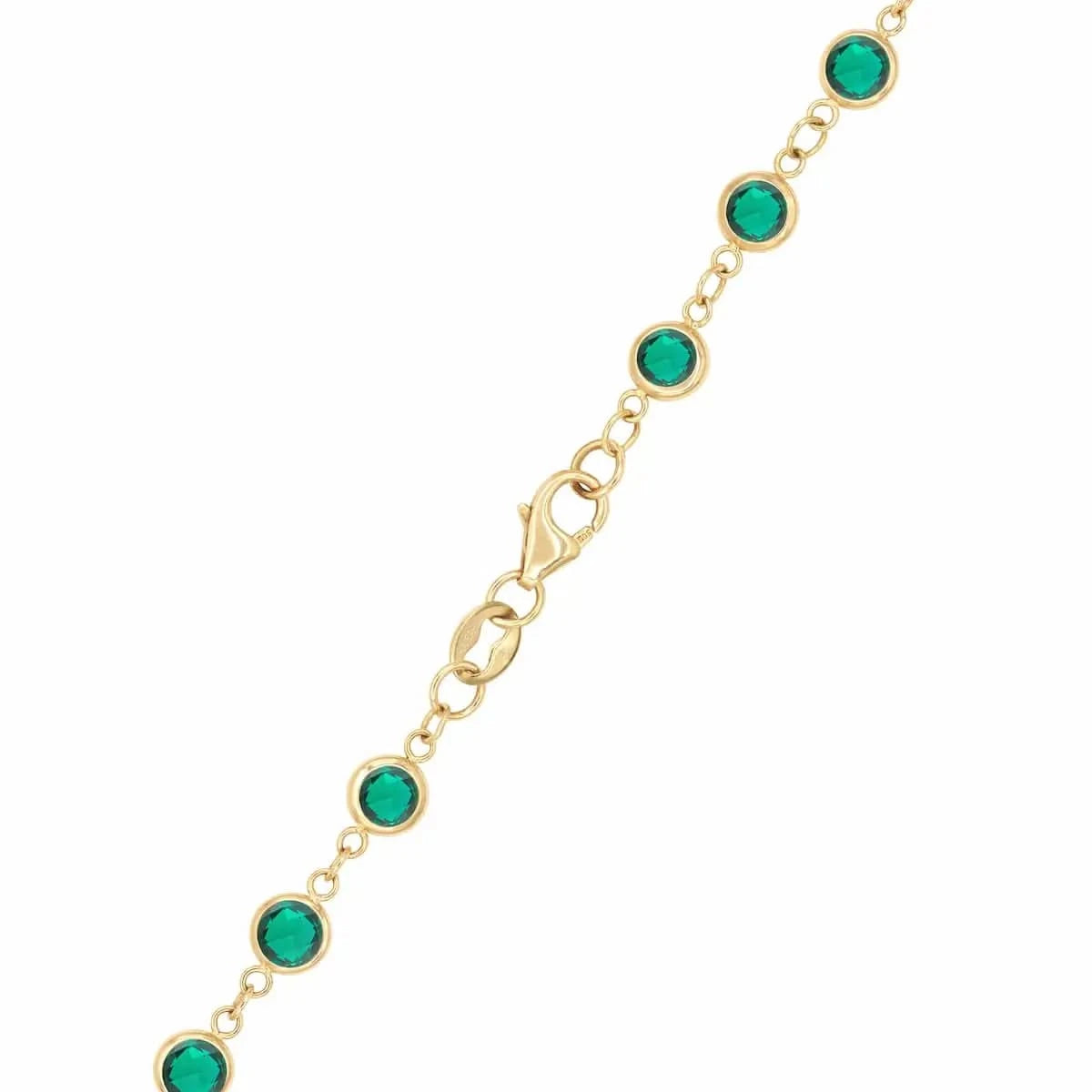 14k yellow gold 1.17 mm cable chain with a lobster claw clasp and 4 mm briolette cut bezel set Emeralds.