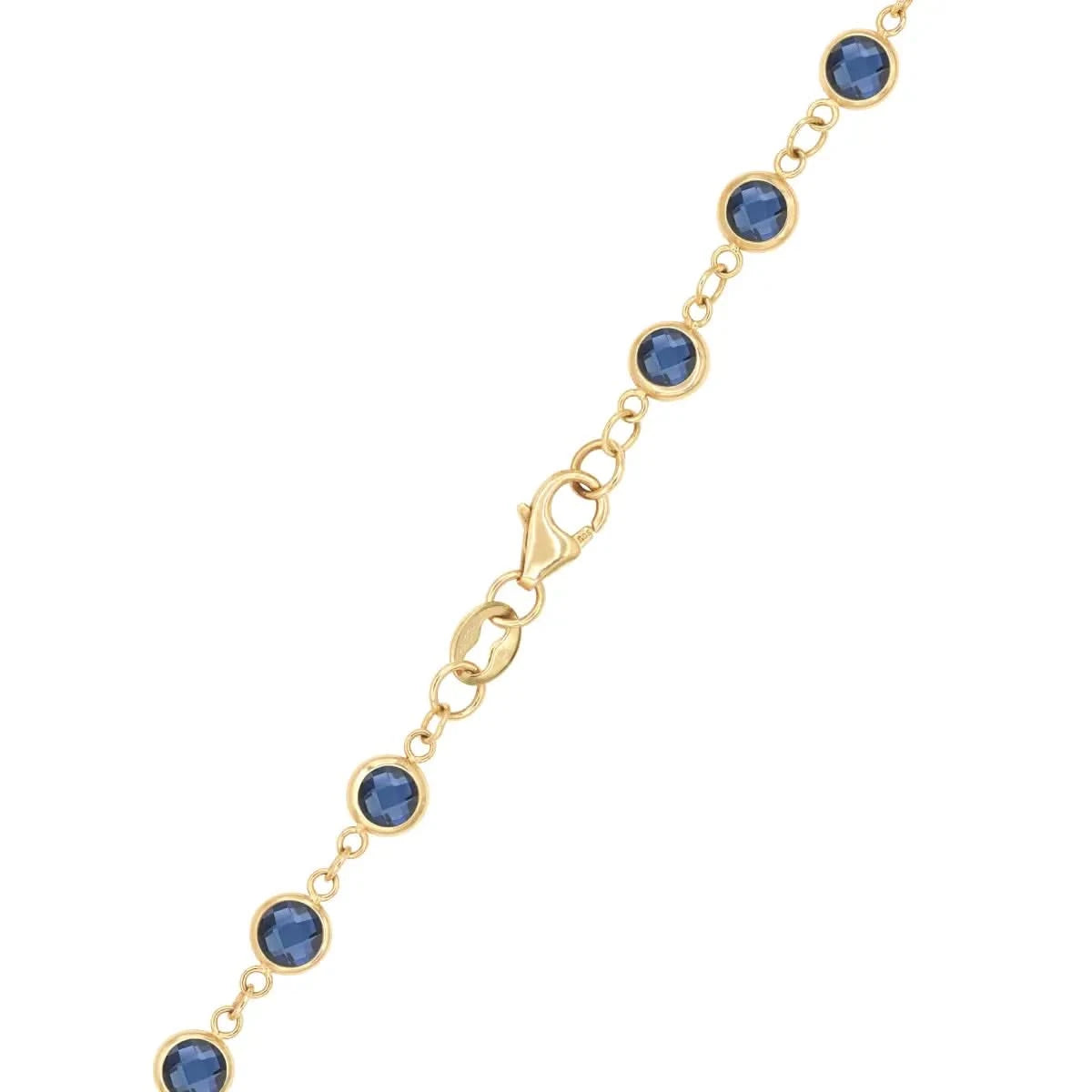 Close-up of the Newport Sapphire Long Necklace in 14k gold, featuring bezel-set faceted blue sapphires and a lobster claw clasp.