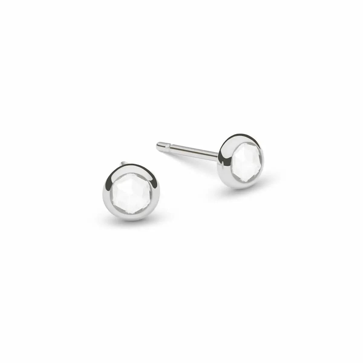 Pair of Birthstone Stud Earrings featuring 4 mm briolette cut White Topaz bezel set in 14k white gold - front view