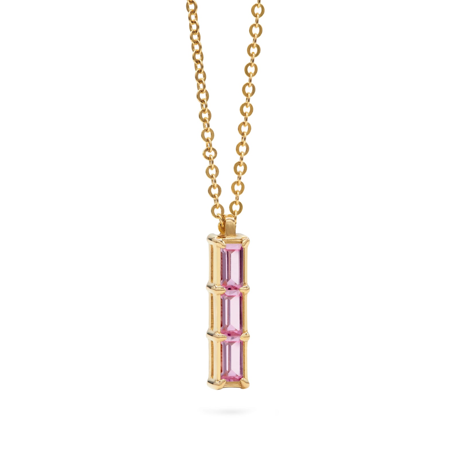 Providence Pink Sapphire vertical bar pendant featuring 3 petite baguette stones set in 14k yellow gold - angled view