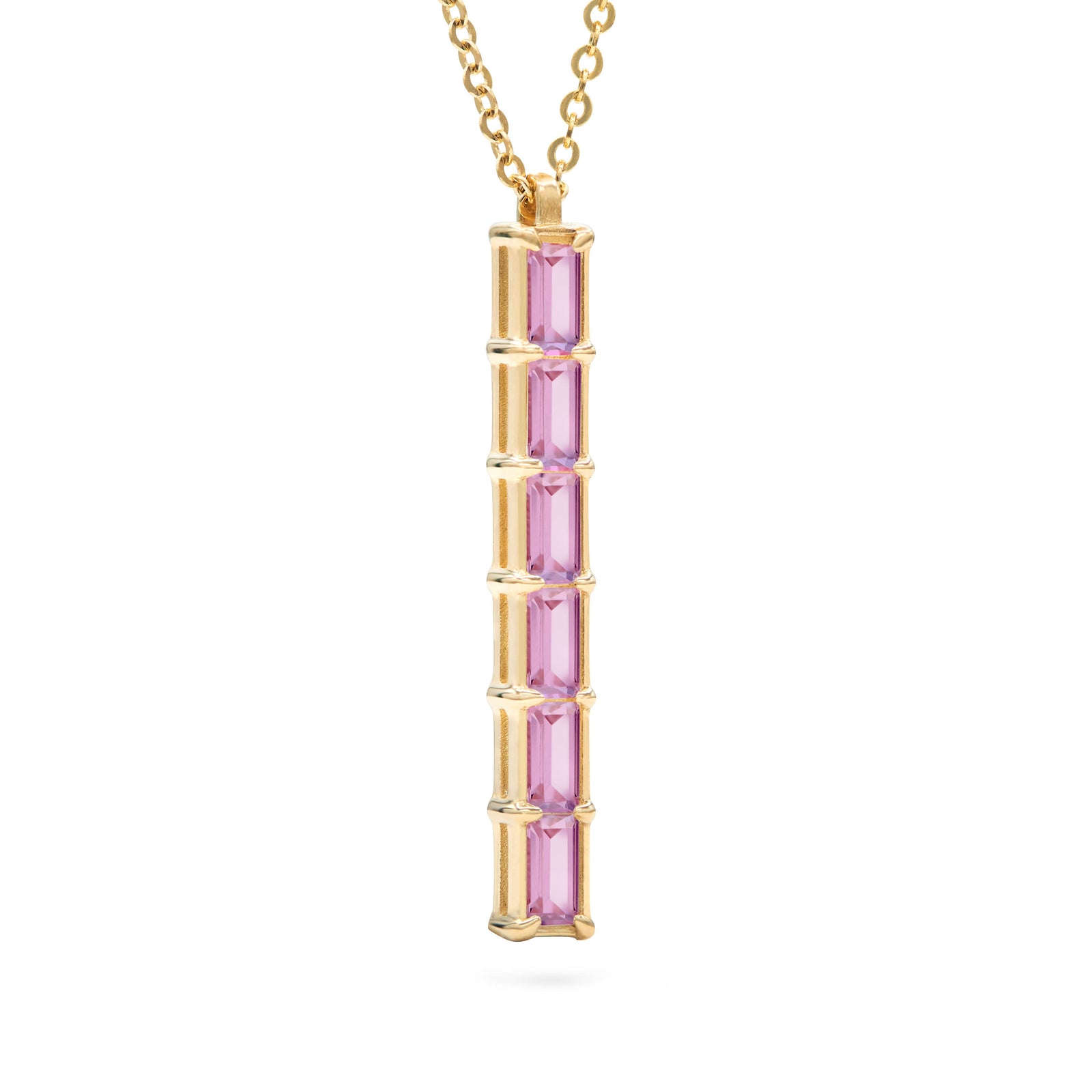 Providence vertical bar pendant featuring 6 petite Pink Sapphire baguette stones set in 14k yellow gold - angled view
