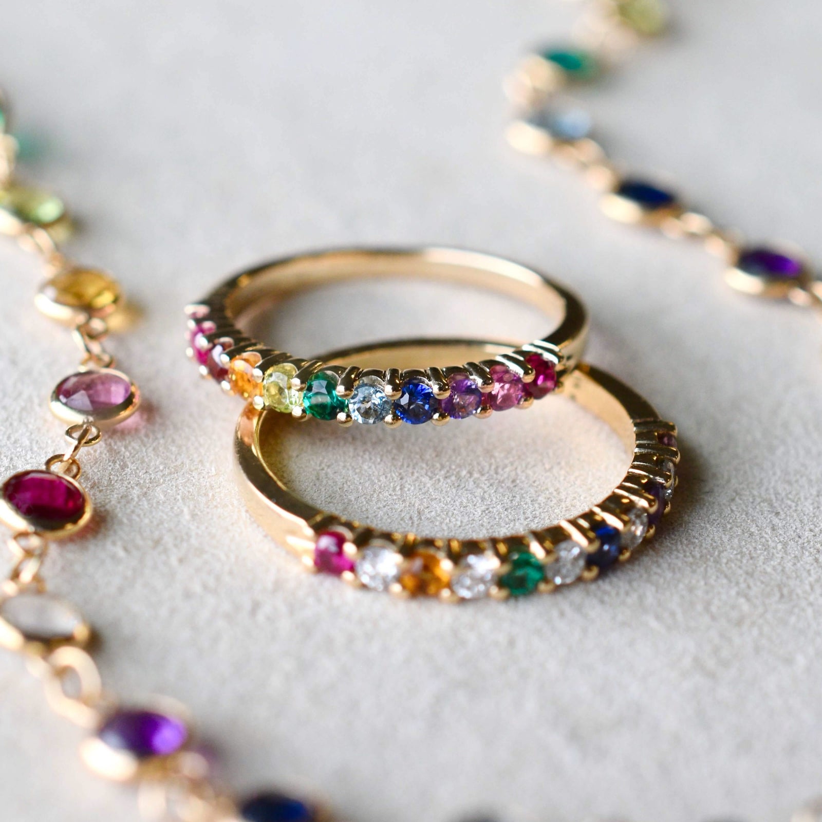 Rosecliff Rainbow Stackable Rings: one with alternating diamonds, the other without. Features 2mm rubies, citrines, emeralds, sapphires, amethysts, pink sapphires.