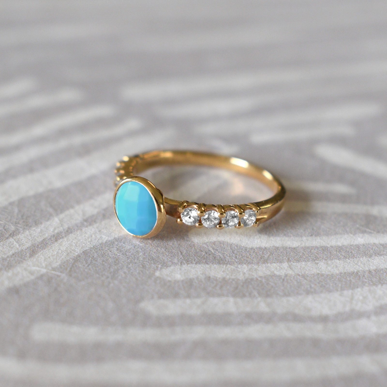 14k gold Rosecliff Grand Ring, featuring a 6 mm round, briolette-cut Turquoise and eight 2 mm round-cut Diamonds