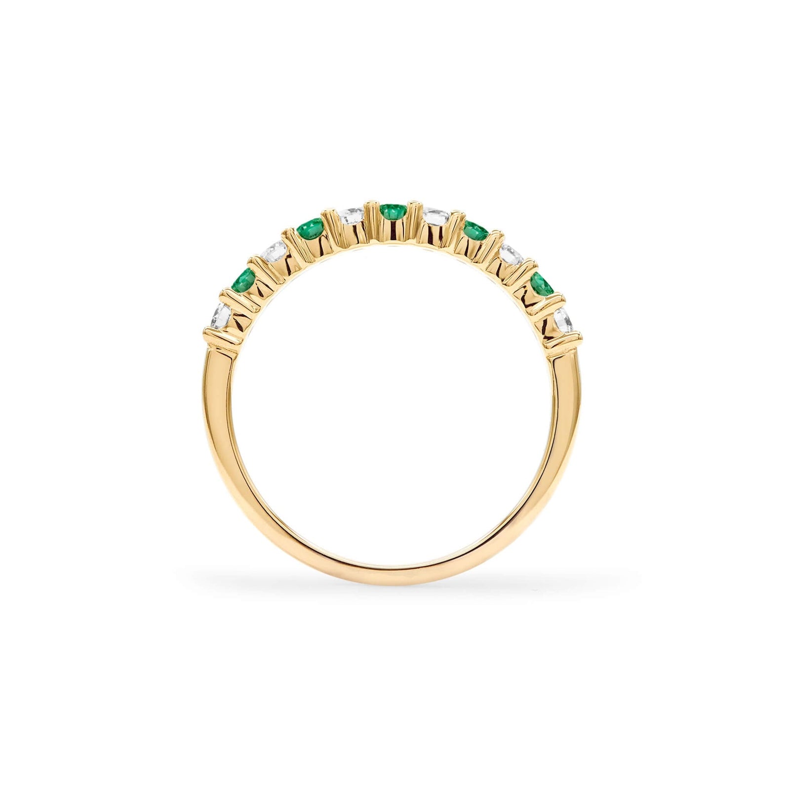 Rosecliff stackable ring featuring eleven alternating 2mm emeralds and diamonds prong set in 14k yellow gold - standing view