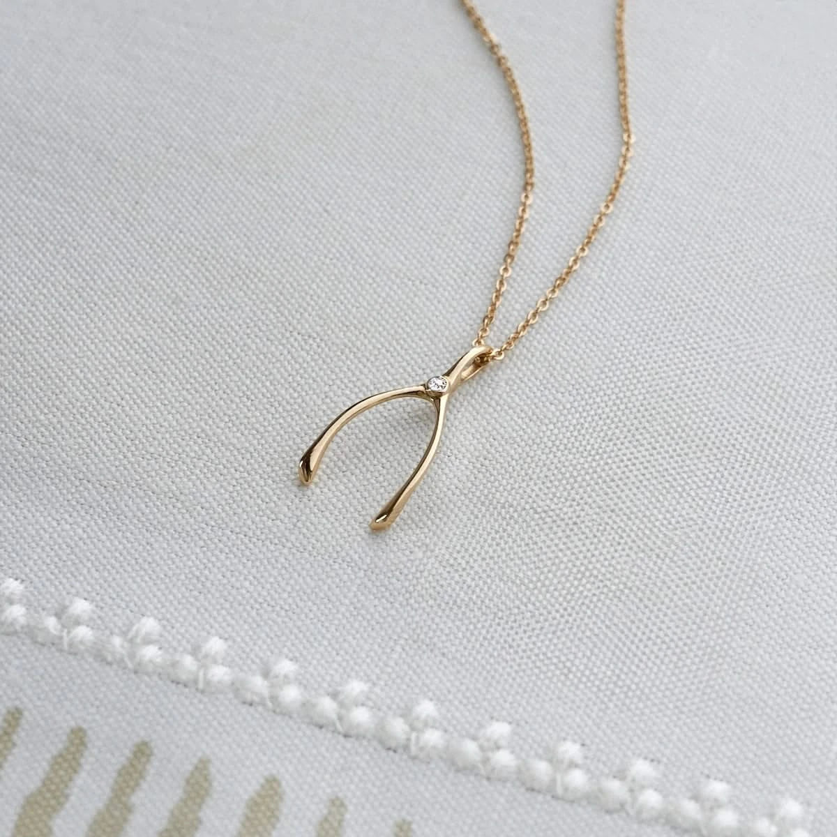Small Diamond Wishbone Pendant in Solid 14k Gold (April)