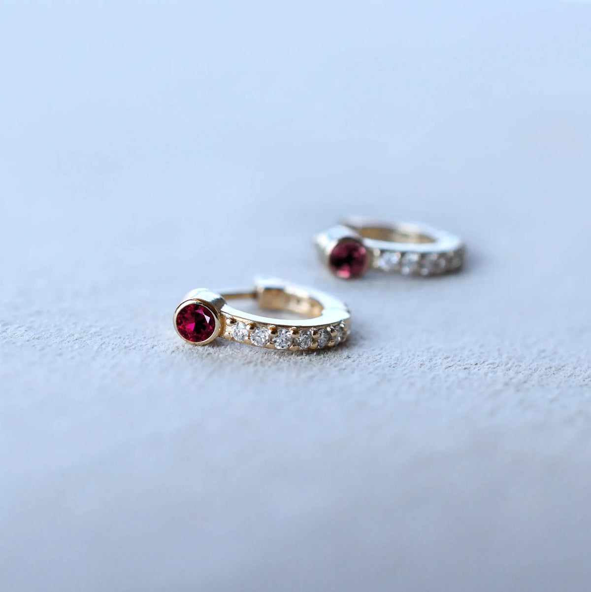 Tiny Ruby Huggie Hoops with Diamonds in 14k Gold (July)