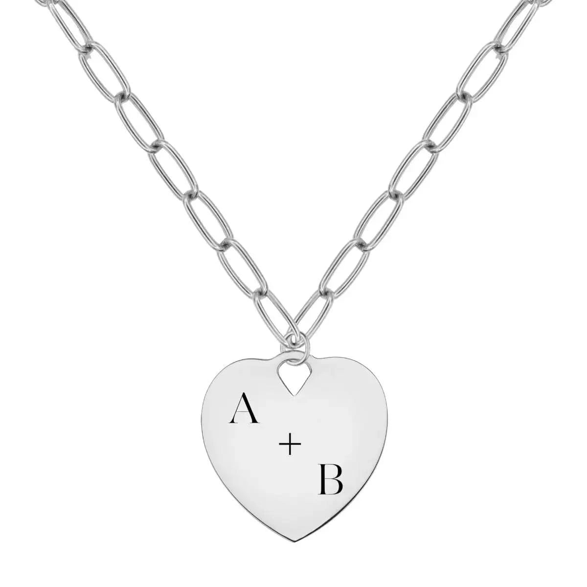 14k white gold heart pendant engraved with “A + B” on an Adelaide chain.
