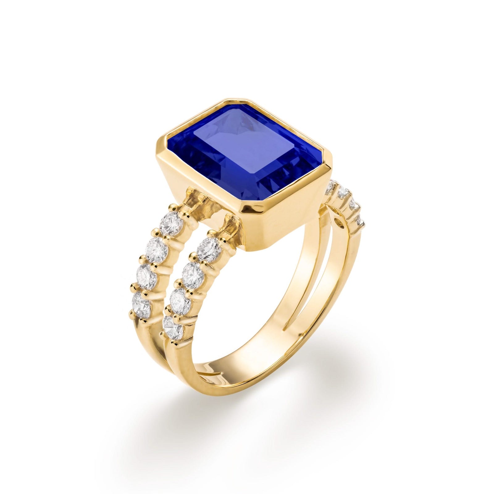 Warren ring in 14k yellow gold with accent diamonds featuring one 10 x 8 mm emerald cut bezel set sapphire - aspect view