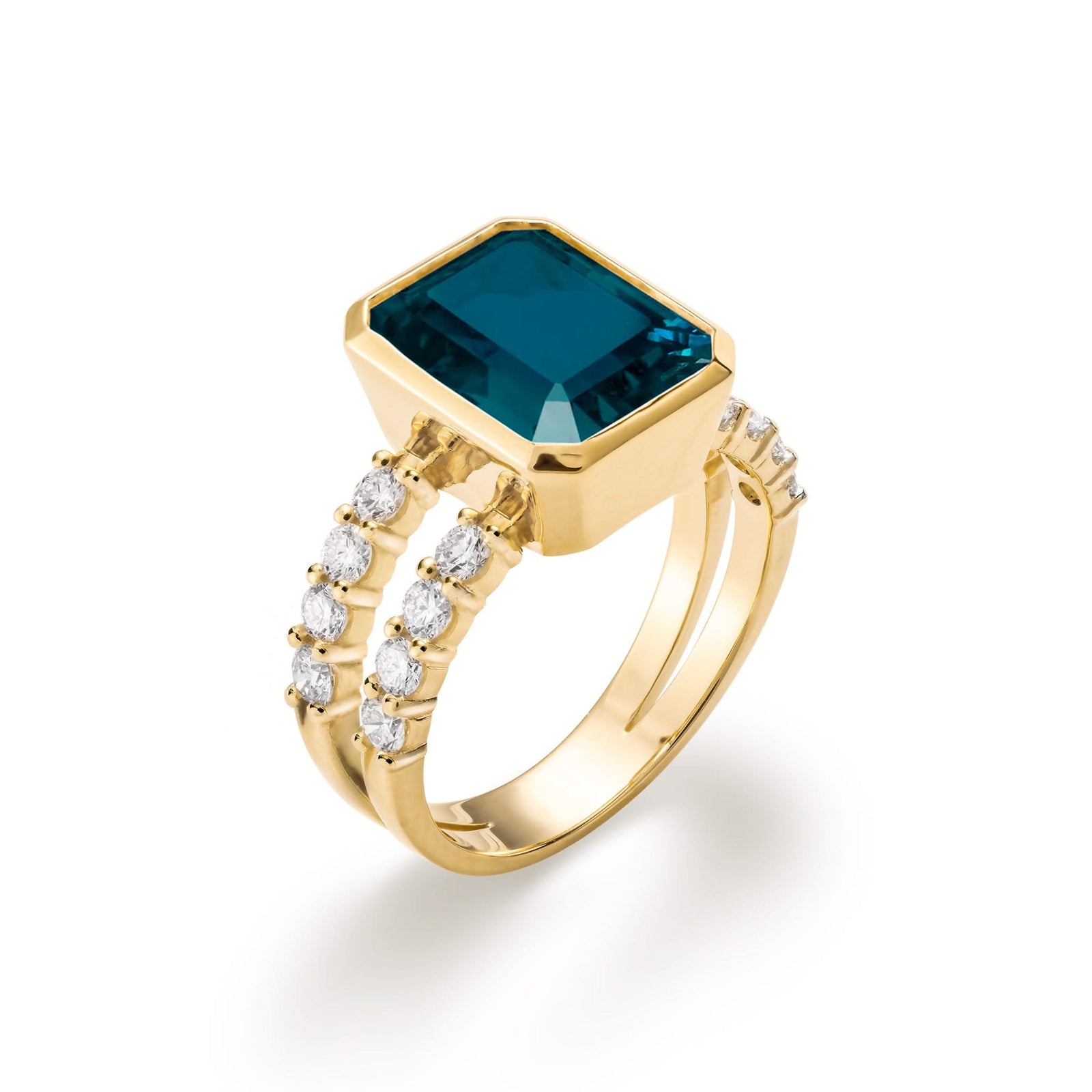 Warren ring in 14k yellow gold with accent diamonds featuring one 10 x 8 mm emerald cut Atlantic Blue Topaz - aspect view