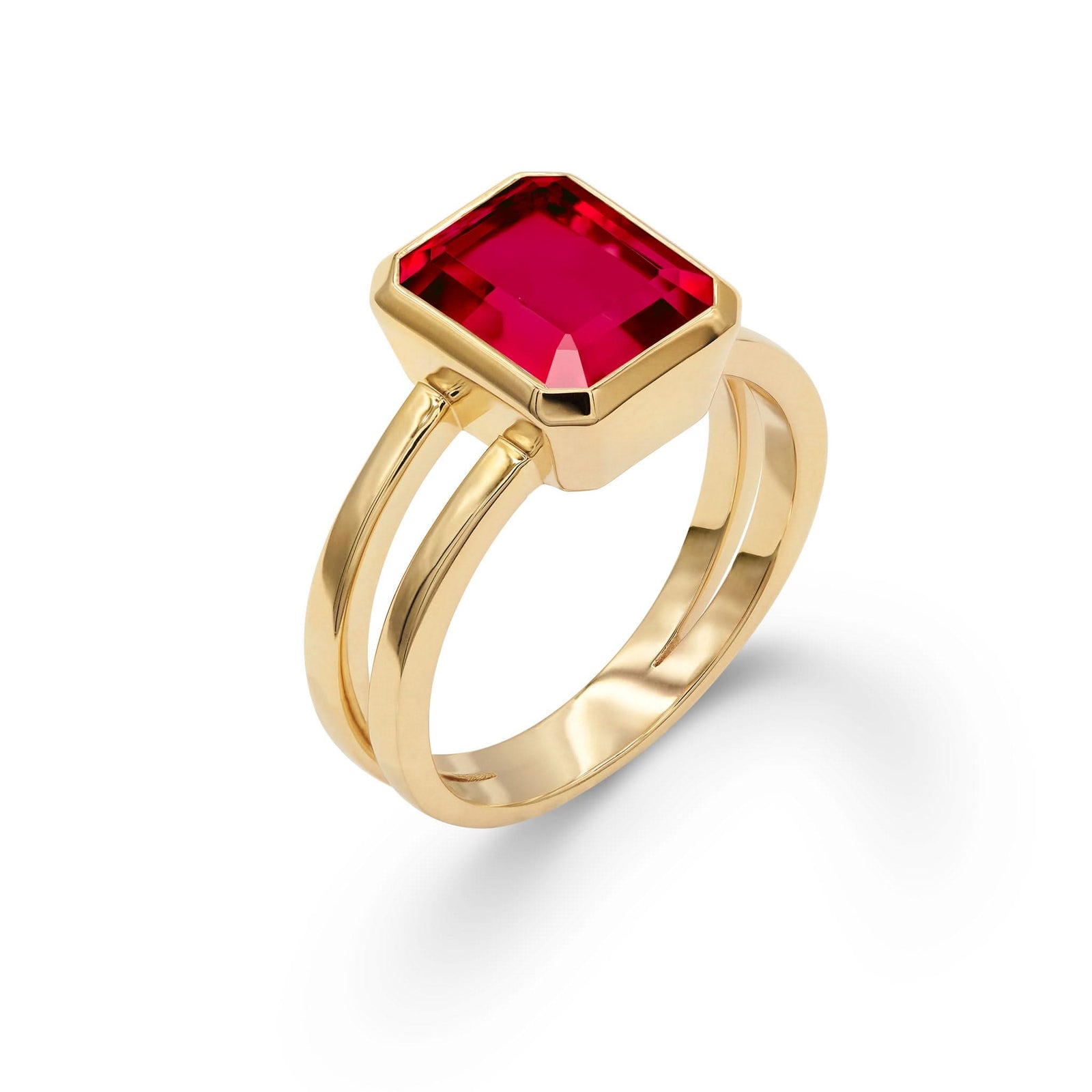 Warren ring in 14k yellow gold featuring one 10 x 8 mm emerald cut bezel set ruby - aspect view