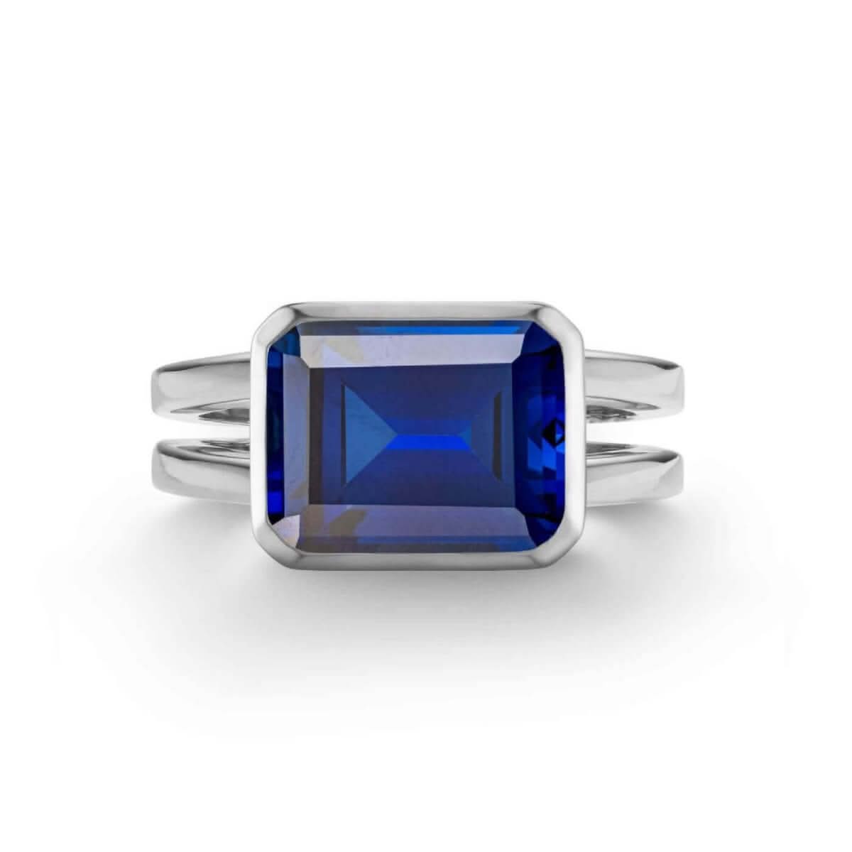 Warren Horizontal Sapphire Ring, featuring an emerald-cut 8 x 10mm sapphire in 14k white gold - front view.