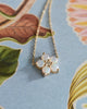 Greenwich Flower necklace featuring five 4mm opals and one 2.7mm center diamond on a 1.17mm cable chain in 14k yellow gold.