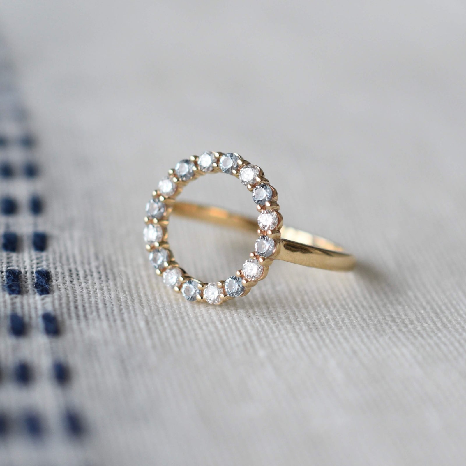 Personalized Rosecliff open circle ring featuring 16 alternating 2 mm round cut gemstones & diamonds prong set in 14k gold