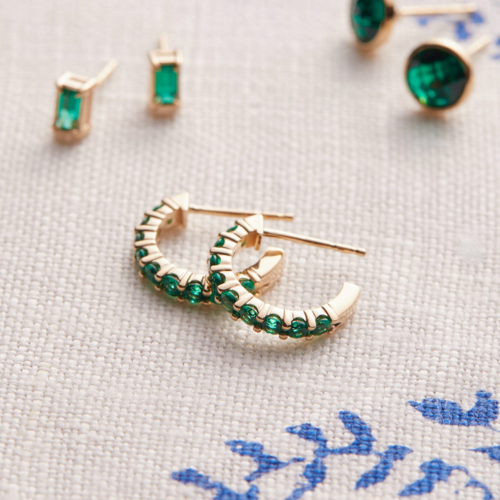 Rosecliff Emerald Huggie Hoop Earrings in 14k Gold (May)