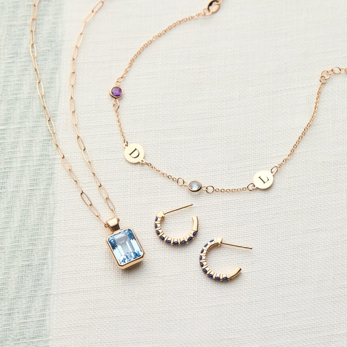 Rosecliff Sapphire Huggie Hoop Earrings in 14k Gold (September)