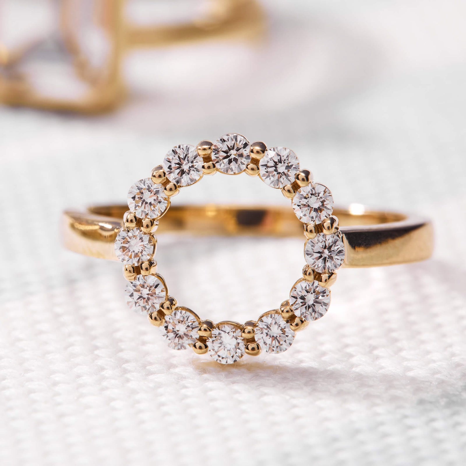 Rosecliff small open circle ring featuring twelve 2 mm round cut diamonds prong set in 14k gold
