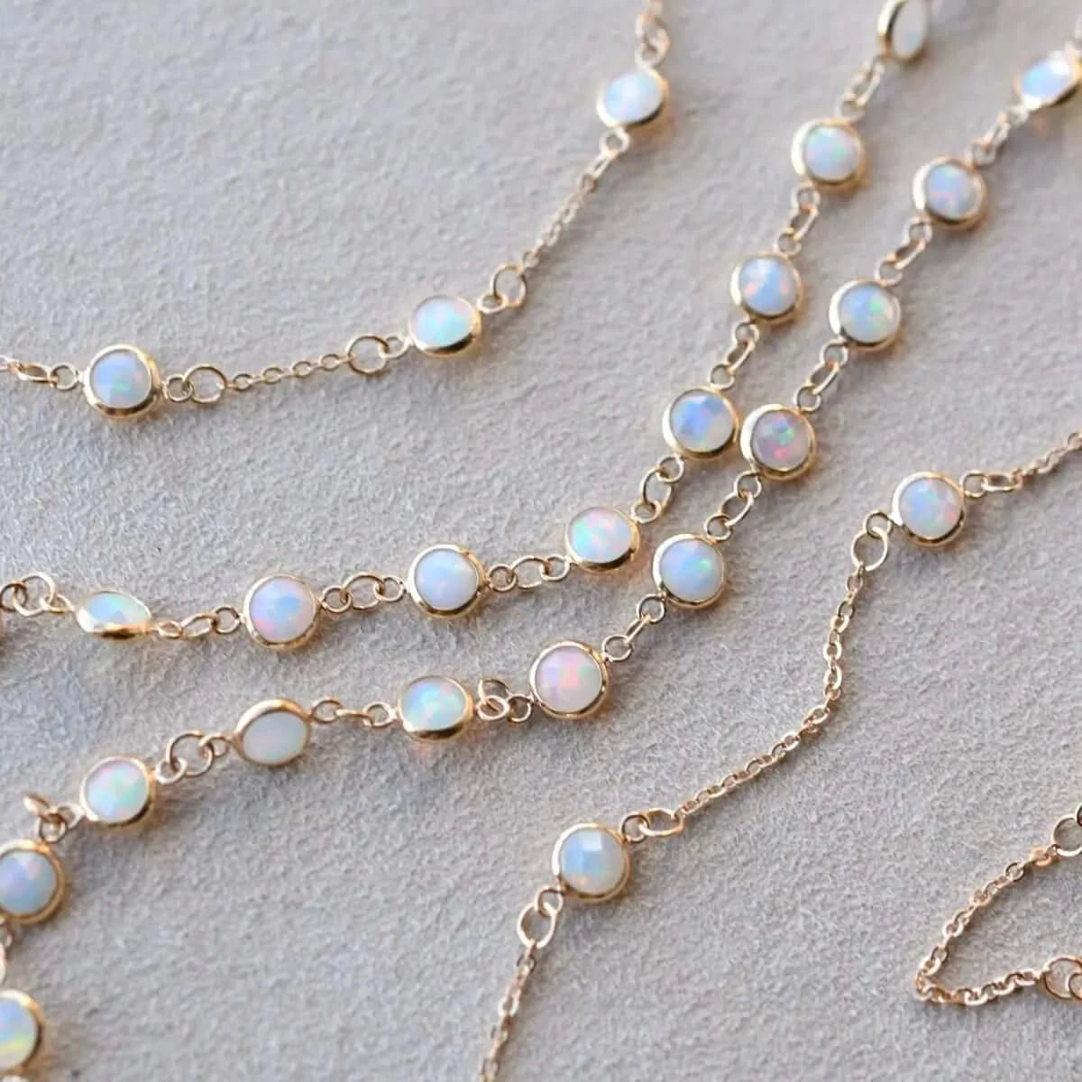 Multiple Newport Opal Bracelets displayed flat to show gemstone arrangement and detail.