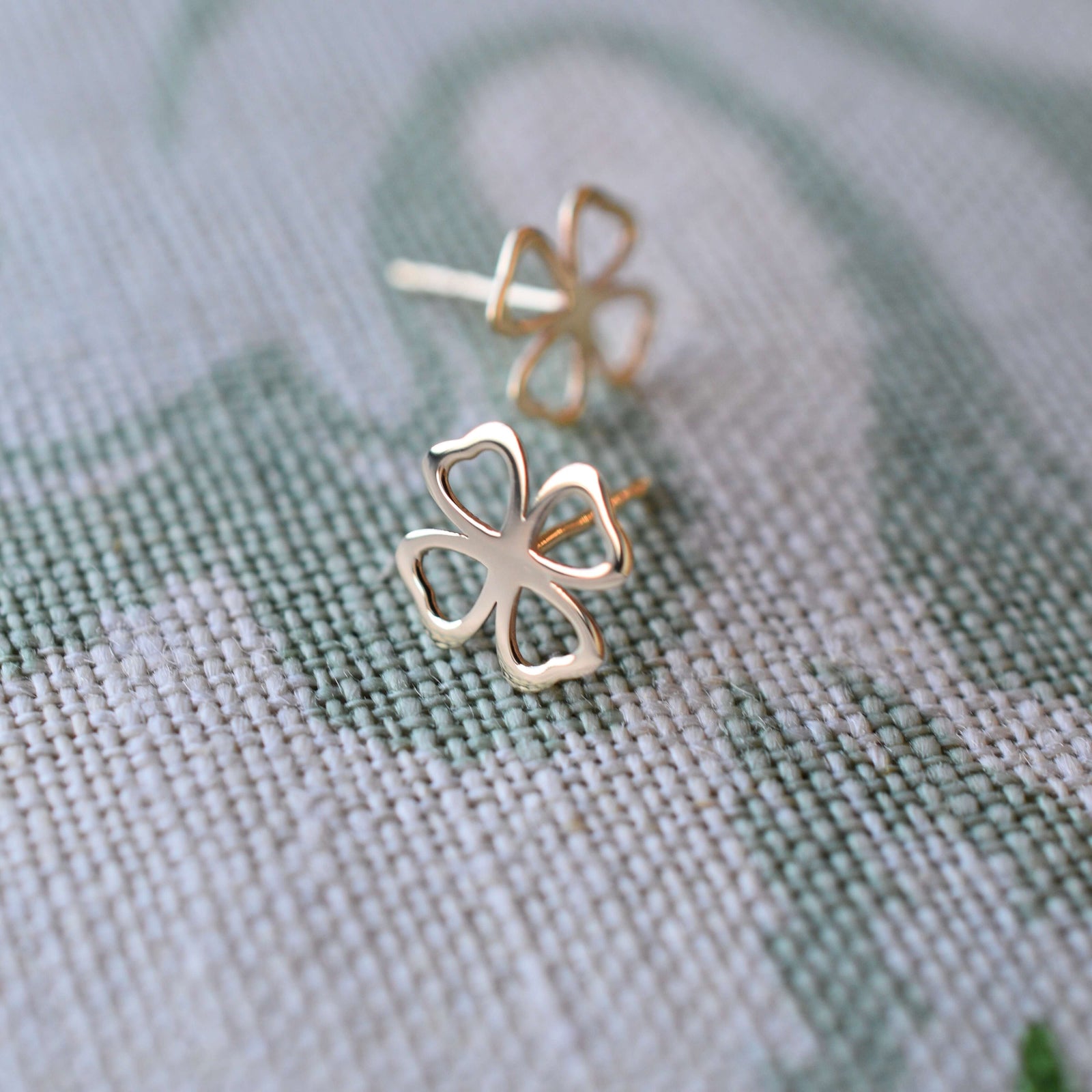 A pair of Clover Stud Earrings in 14k yellow gold bringing good luck, featuring 9.1mm cutout clover.