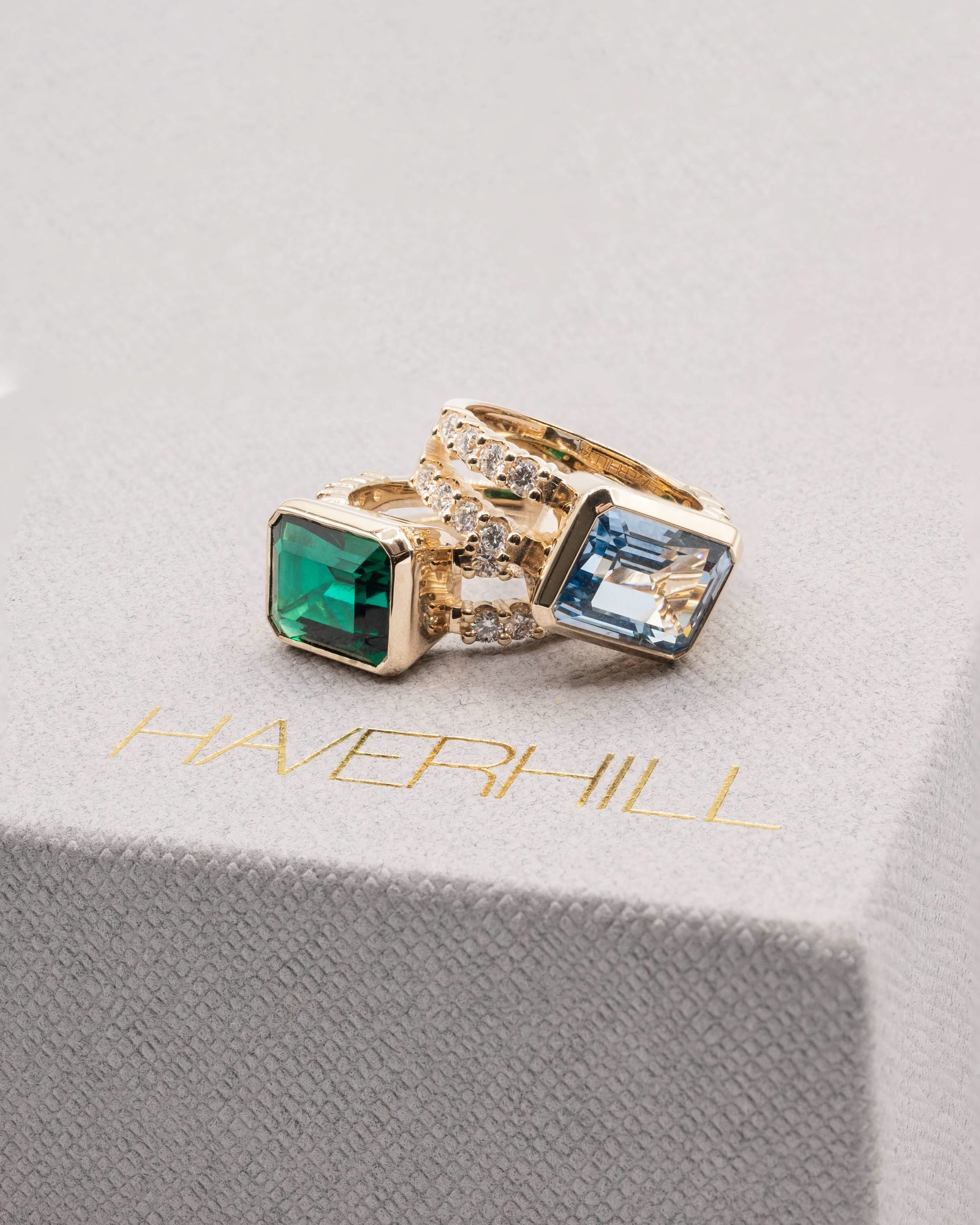 Asorted Haverhill Warren rings, including Warren Horizontal Emerald Ring with Diamonds, featuring an 8 x 10mm Emerald and 16 prong-set diamonds.