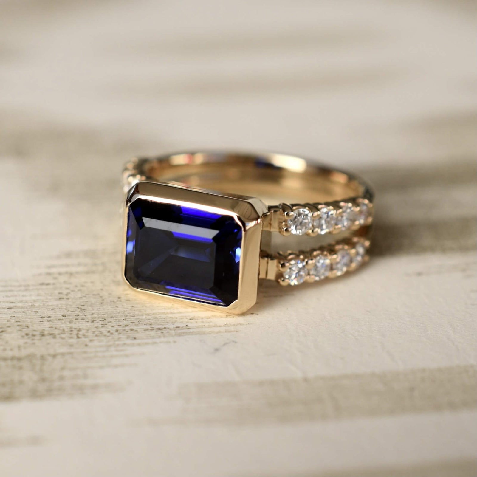 Warren Horizontal Sapphire Ring with Diamonds, featuring an 8 x 10mm Sapphire and 16 prong-set diamonds in 14k yellow gold.