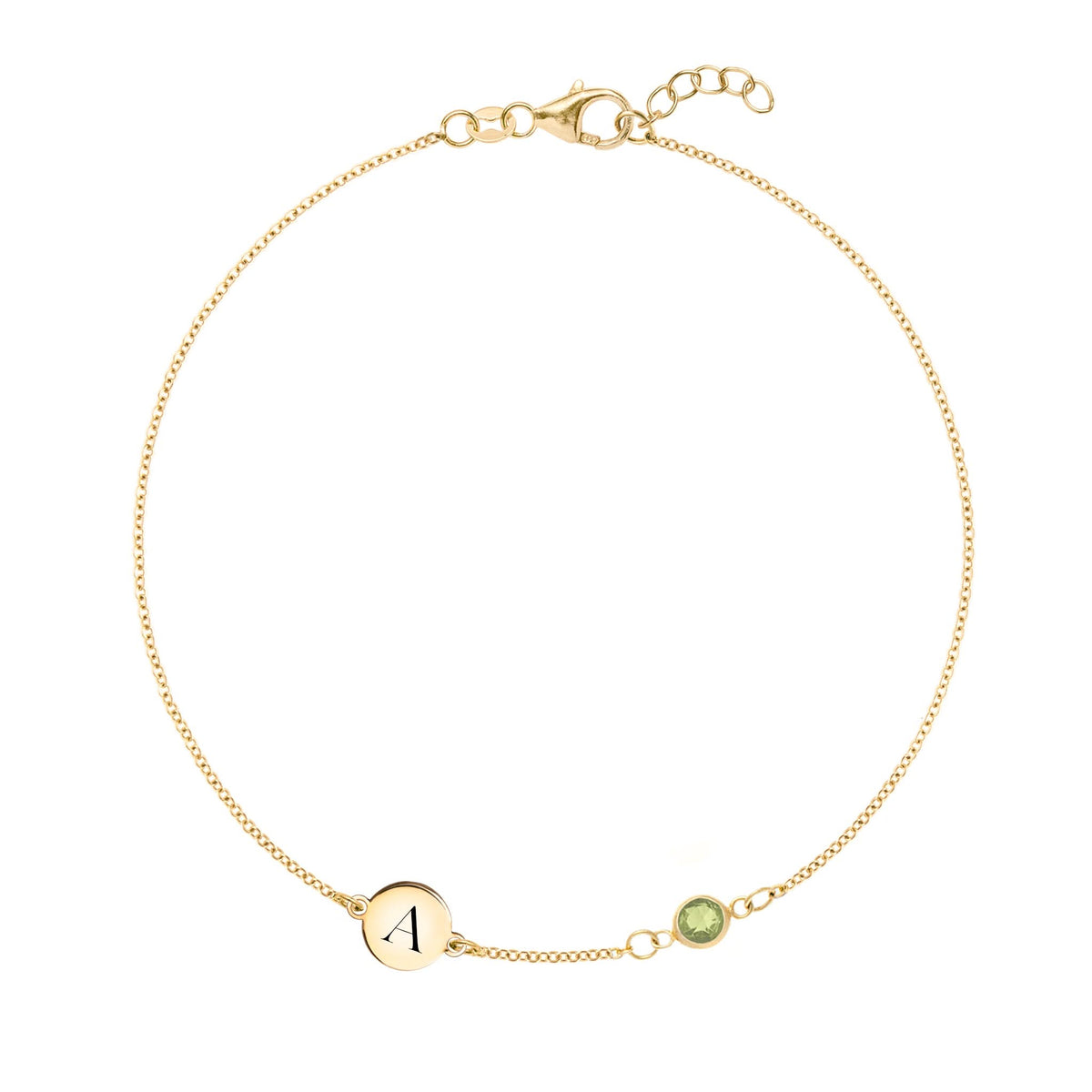 14k yellow gold Classic bracelet featuring one peridot and one 1/4” flat disc engraved with the letter A - front view