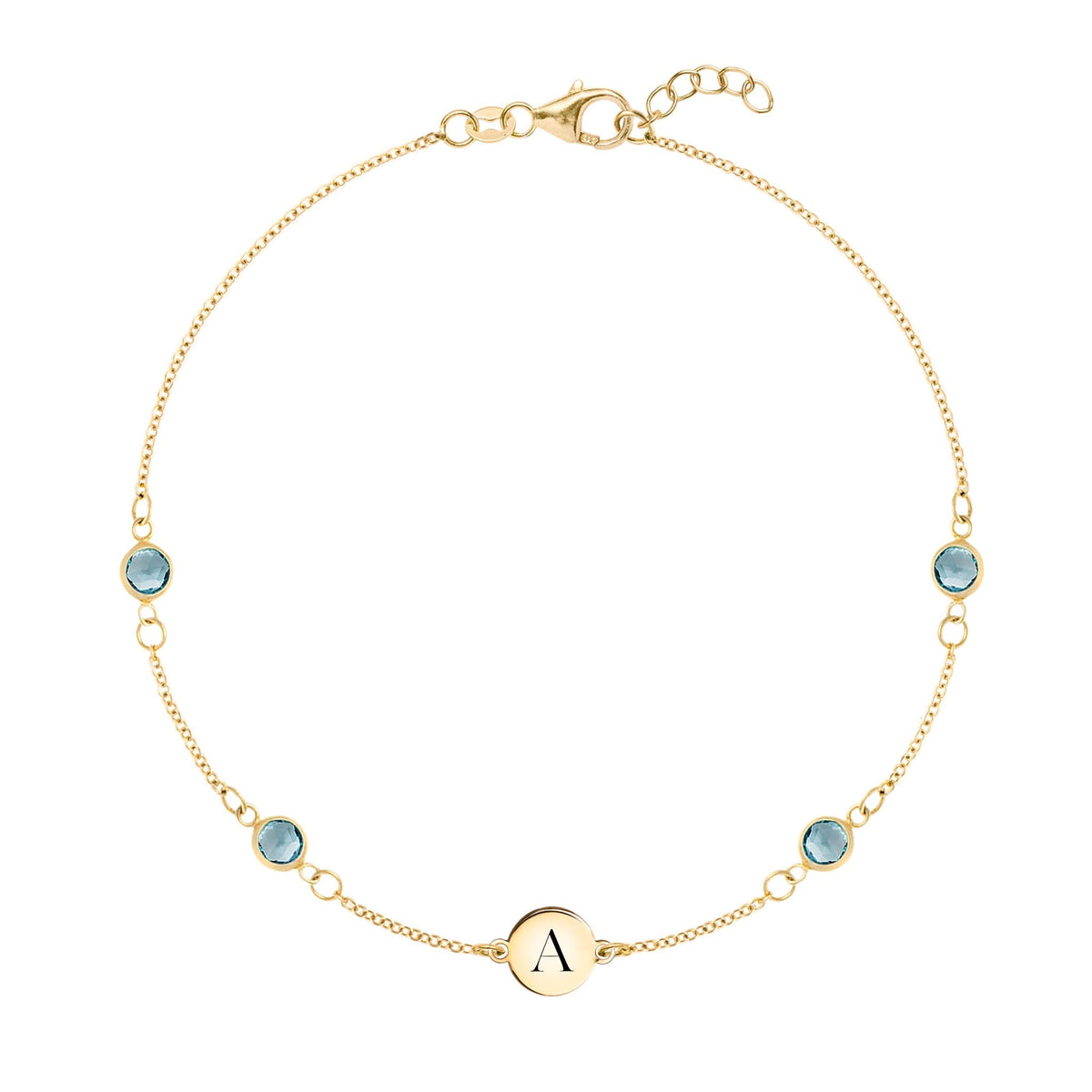 14k gold Classic bracelet featuring four Nantucket blue topaz and one 1/4” flat disc engraved with the letter A - front view