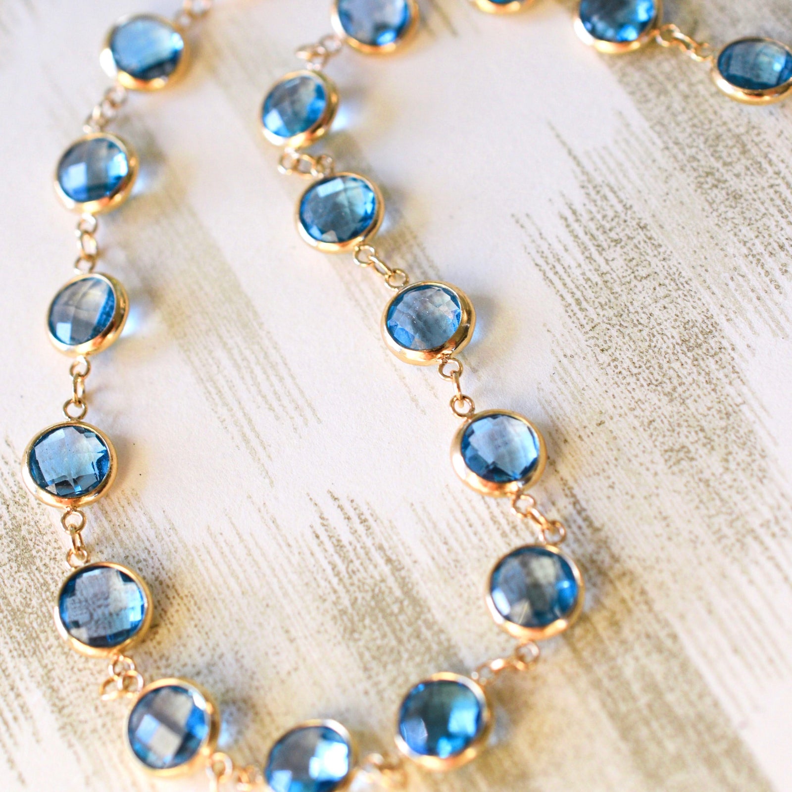 Newport Grand 14k yellow gold necklace featuring 6 mm briolette cut bezel set Nantucket blue topaz