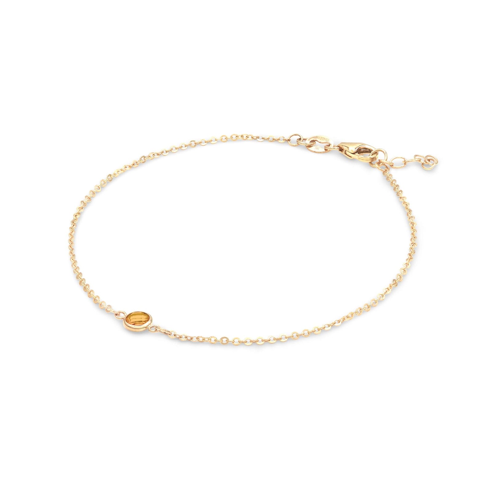 Classic cable chain bracelet featuring one 4 mm briolette cut citrine bezel set in 14k yellow gold - angled view