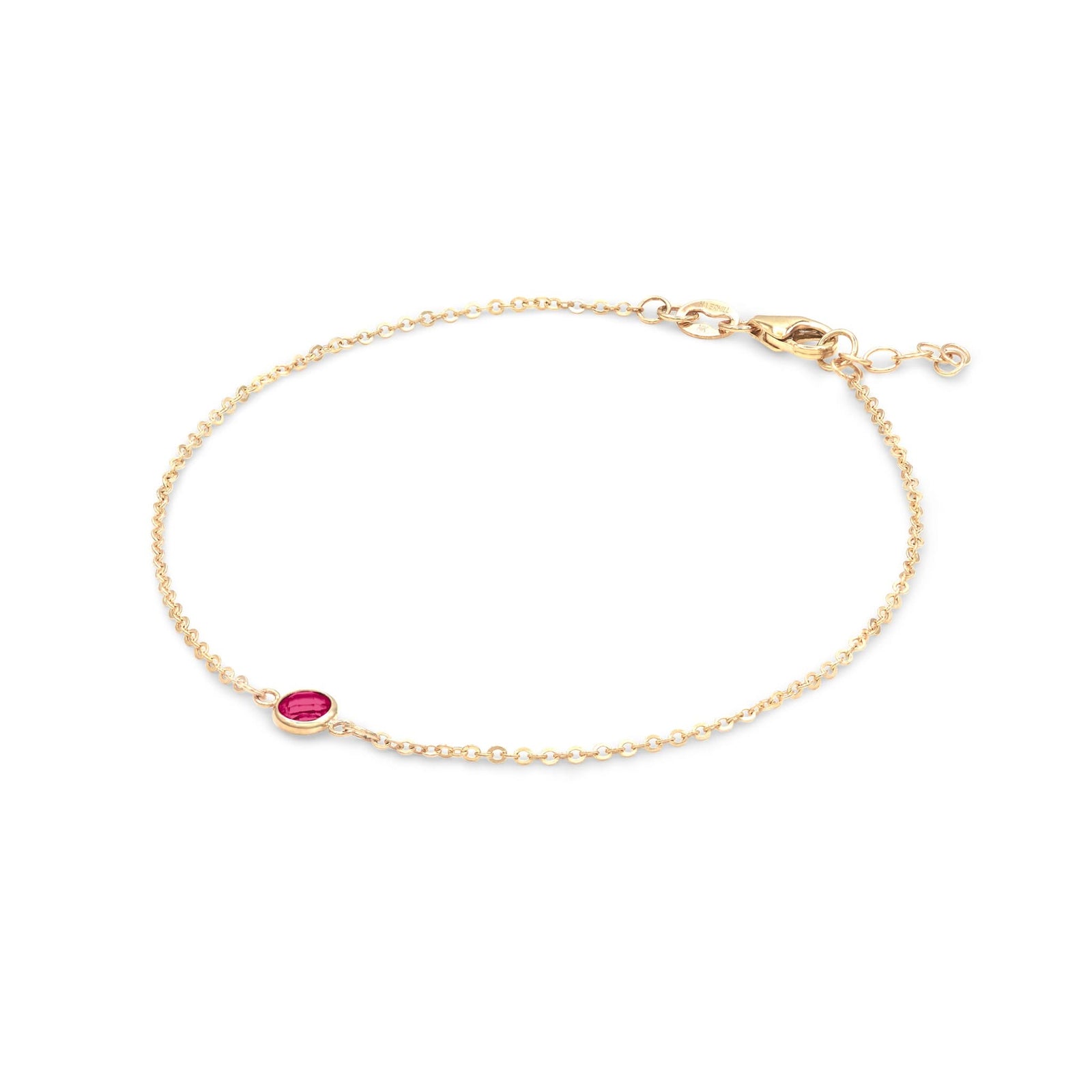 Classic cable chain bracelet featuring one 4 mm briolette cut ruby bezel set in 14k yellow gold - angled view