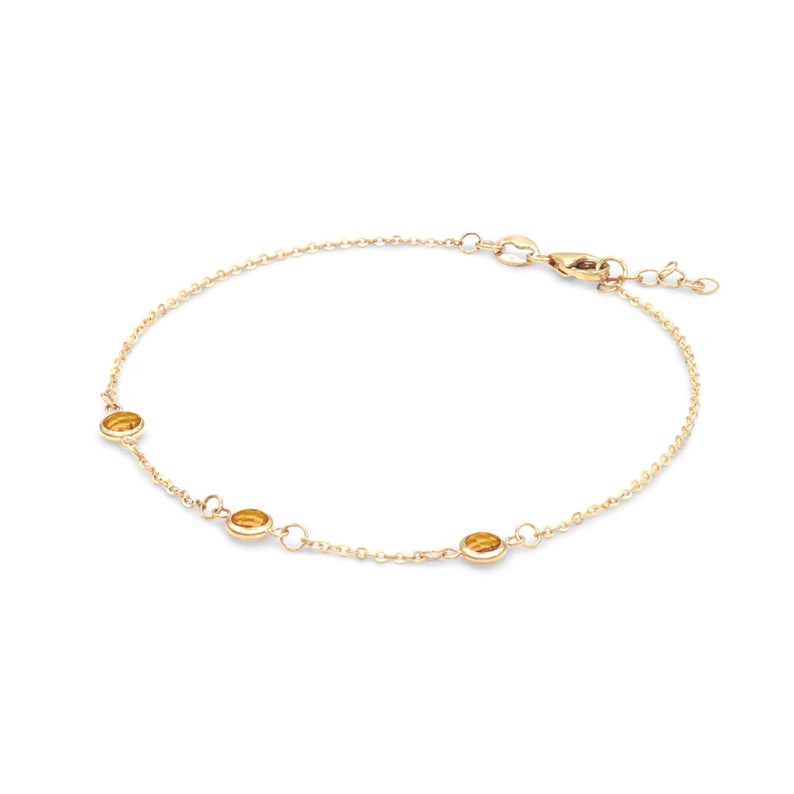 Bayberry 1.17 mm cable chain birthstone bracelet featuring three 4 mm briolette citrines bezel set in 14k gold - angled view