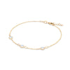 Bayberry cable chain birthstone bracelet featuring three 4 mm briolette moonstones bezel set in 14k gold - angled view