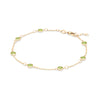 Bayberry 1.17 mm cable chain birthstone bracelet featuring seven 4 mm briolette peridots bezel set in 14k gold - angled view