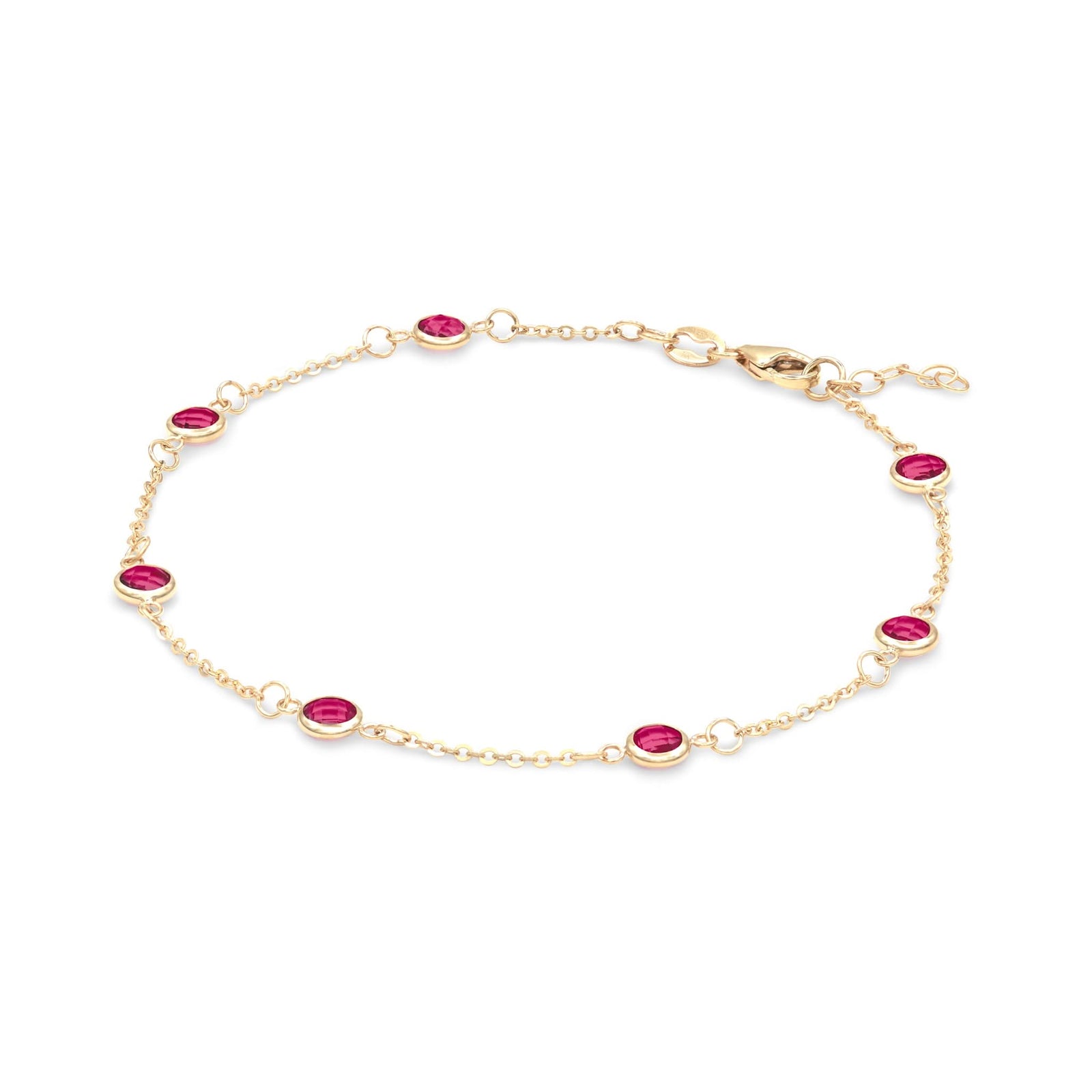 Bayberry 1.17 mm cable chain birthstone bracelet featuring seven 4 mm briolette rubies bezel set in 14k gold - angled view