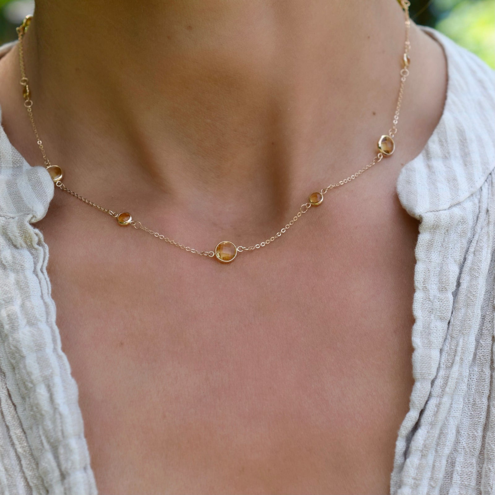 Woman with a Bayberry Grand & Classic 14k yellow gold necklace featuring alternating 4 mm and 6 mm briolette cut citrines
