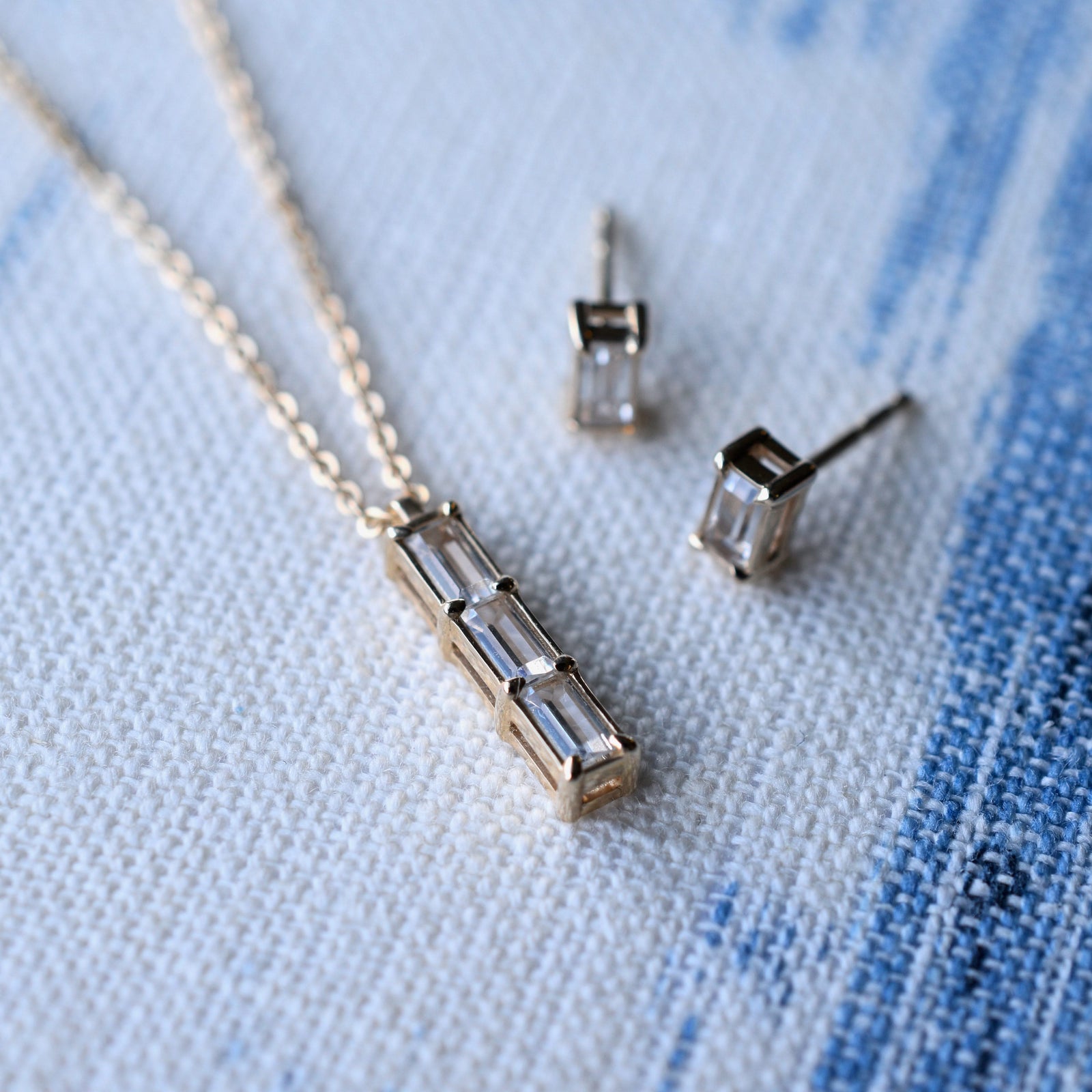 Providence 3 White Topaz pendant and stud earrings set with petite baguette stones set in 14k yellow gold