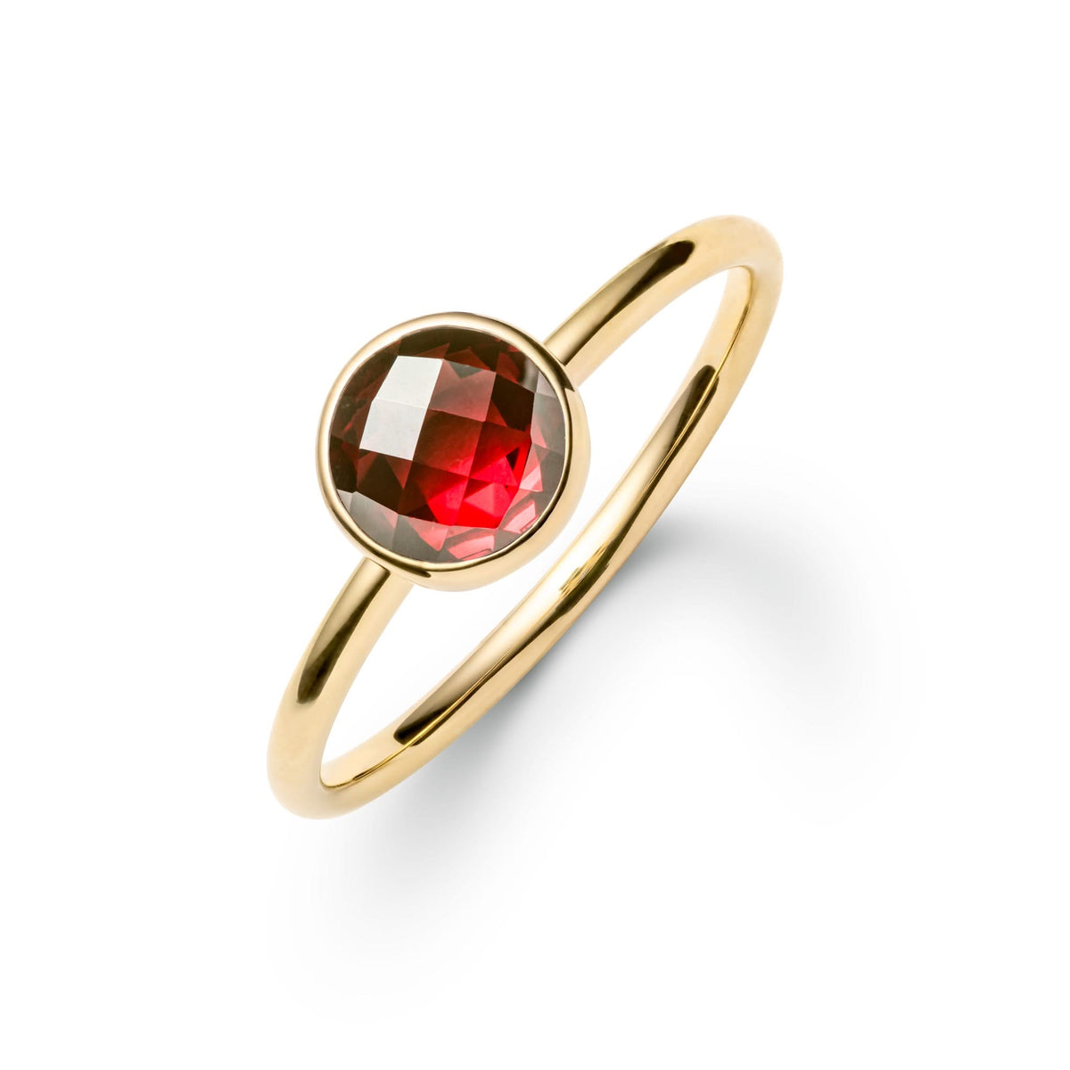 1.6 mm wide 14k yellow gold Grand ring featuring one 6 mm briolette cut bezel set garnet - angled view