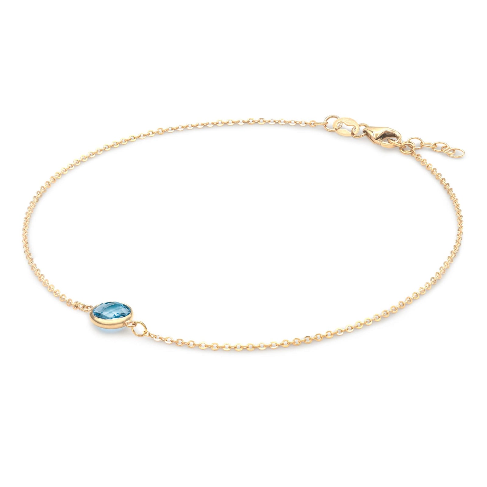 Grand 1.17 mm cable chain bracelet in 14k gold featuring one 6 mm briolette cut bezel set Nantucket blue topaz - angled view