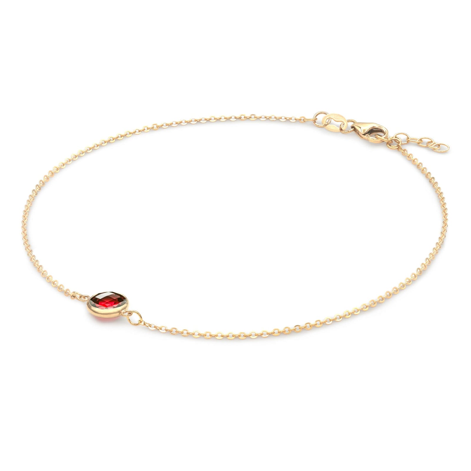 Grand 1.17 mm cable chain bracelet in 14k yellow gold featuring one 6 mm briolette cut bezel set garnet - angled view