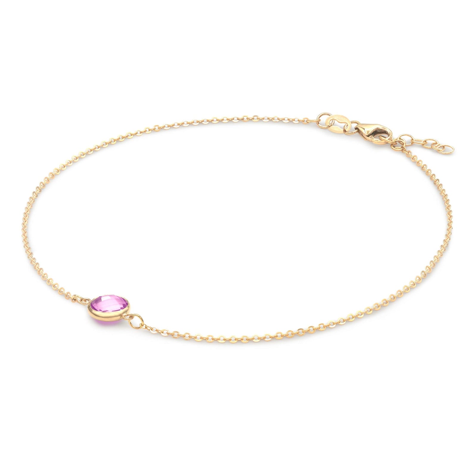Grand 1.17 mm cable chain bracelet in 14k yellow gold featuring one 6 mm briolette cut bezel set pink sapphire - angled view