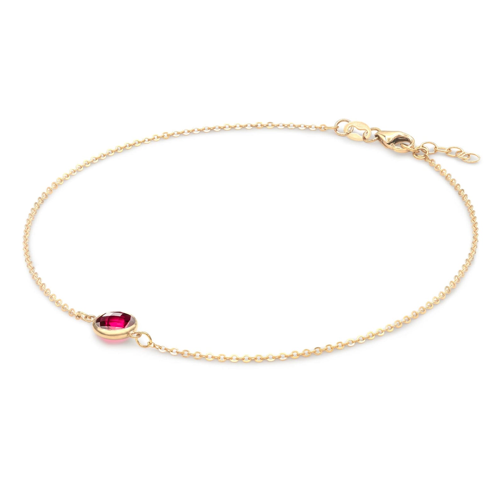 Grand 1.17 mm cable chain bracelet in 14k yellow gold featuring one 6 mm briolette cut bezel set ruby - angled view
