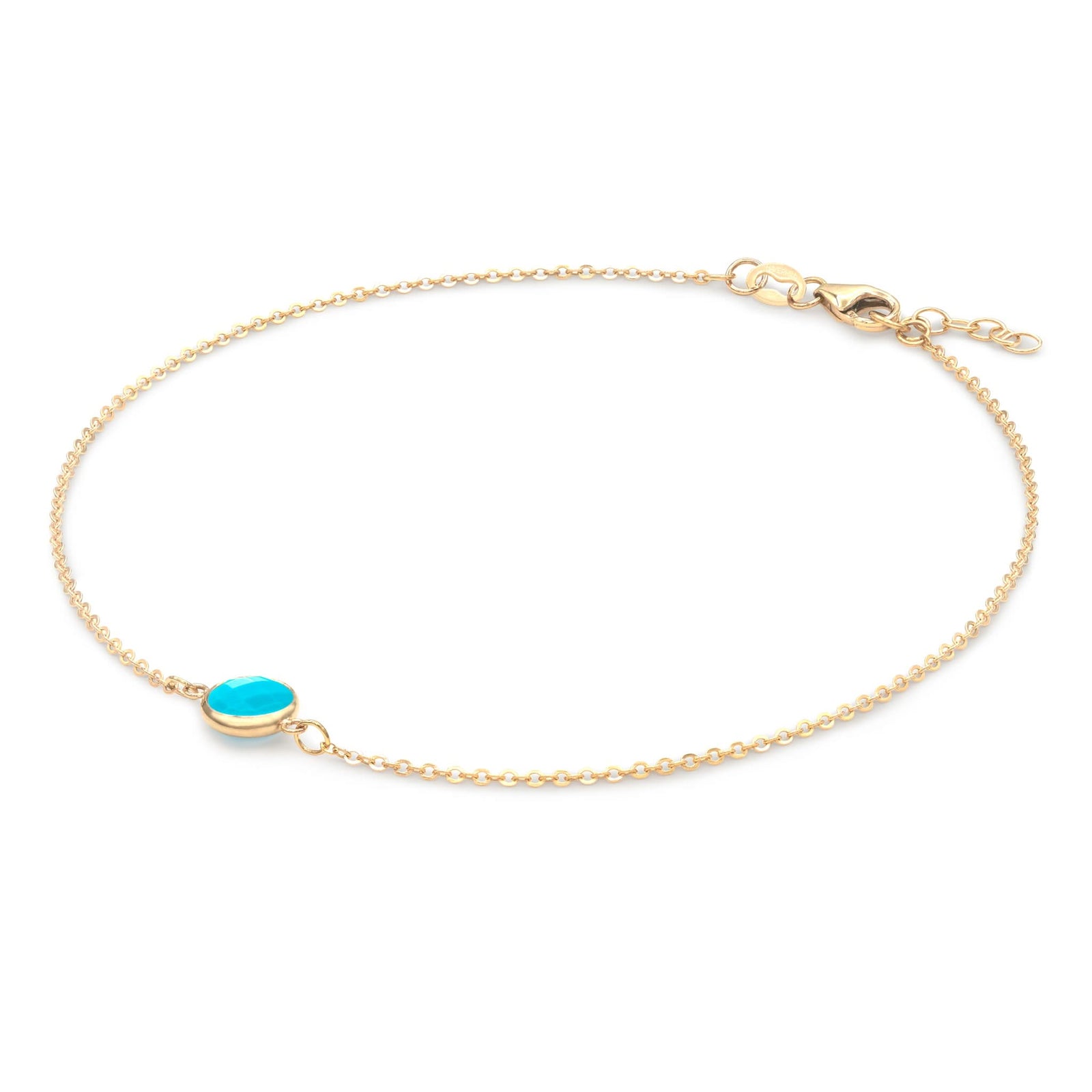 Grand 1.17 mm cable chain bracelet in 14k yellow gold featuring one 6 mm briolette cut bezel set turquoise - angled view