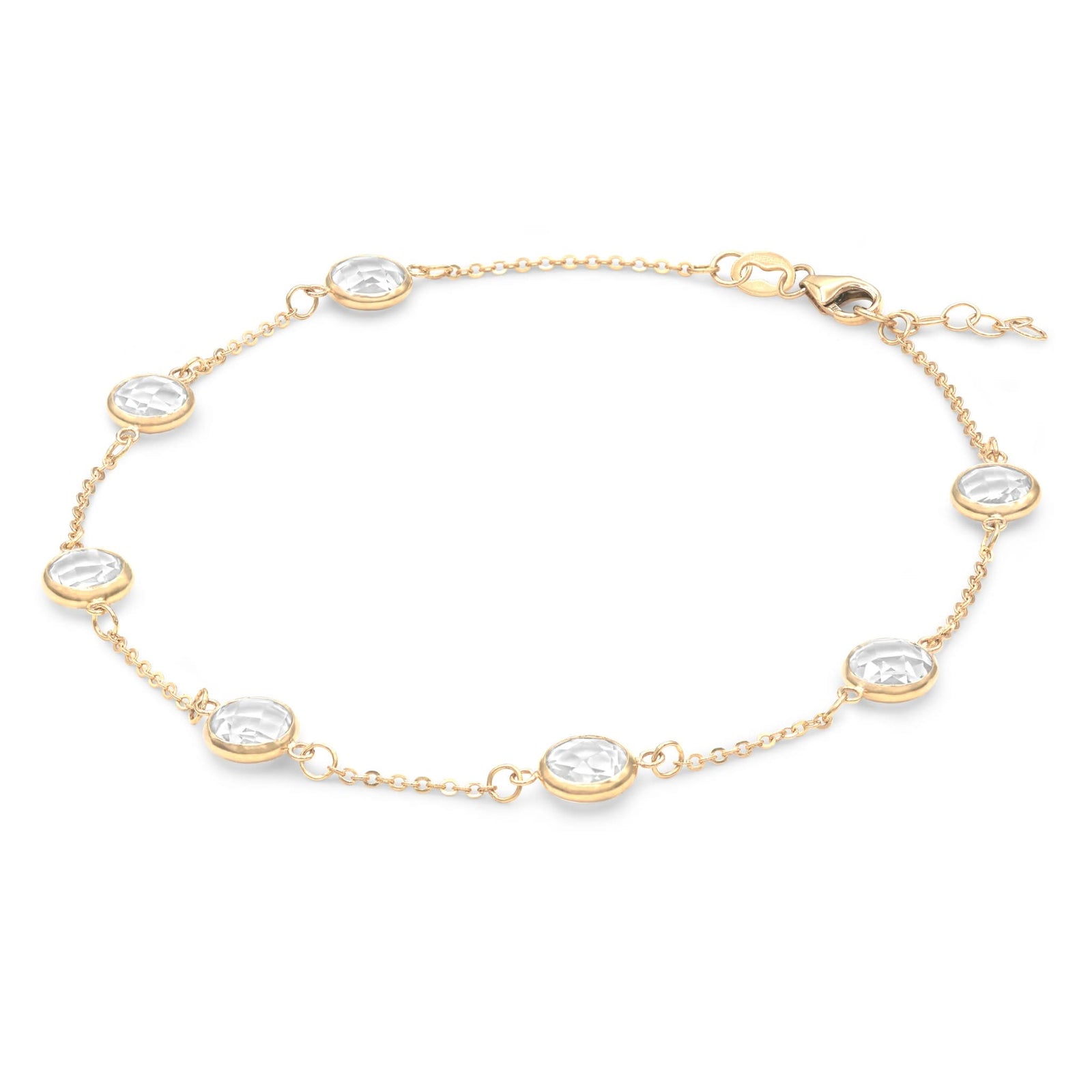 Grand 14k yellow gold bracelet featuring seven 6 mm briolette cut bezel set white topaz - angled view