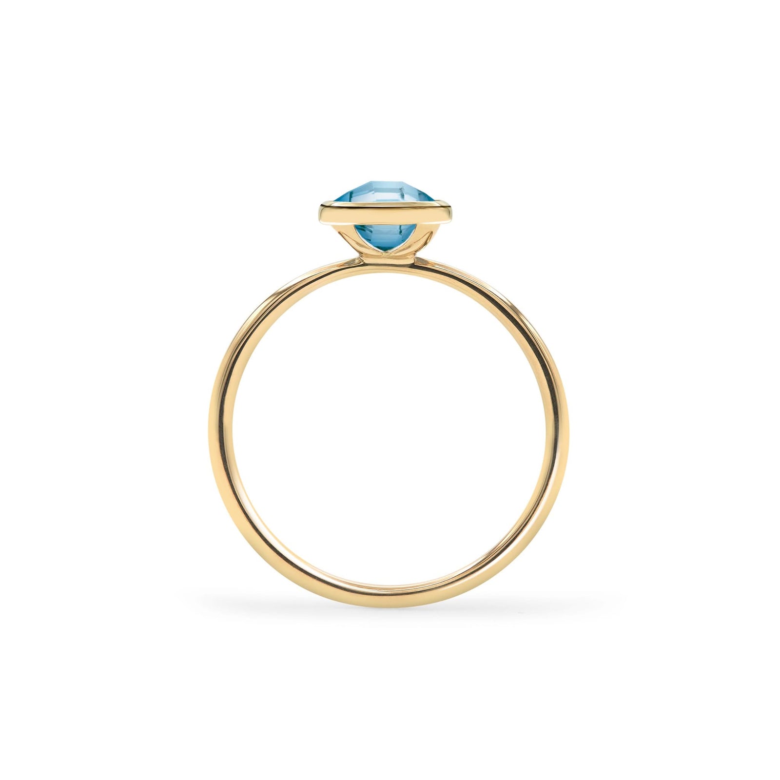 1.6 mm wide 14k yellow gold Grand ring featuring one 6 mm briolette cut bezel set Nantucket blue topaz - standing view