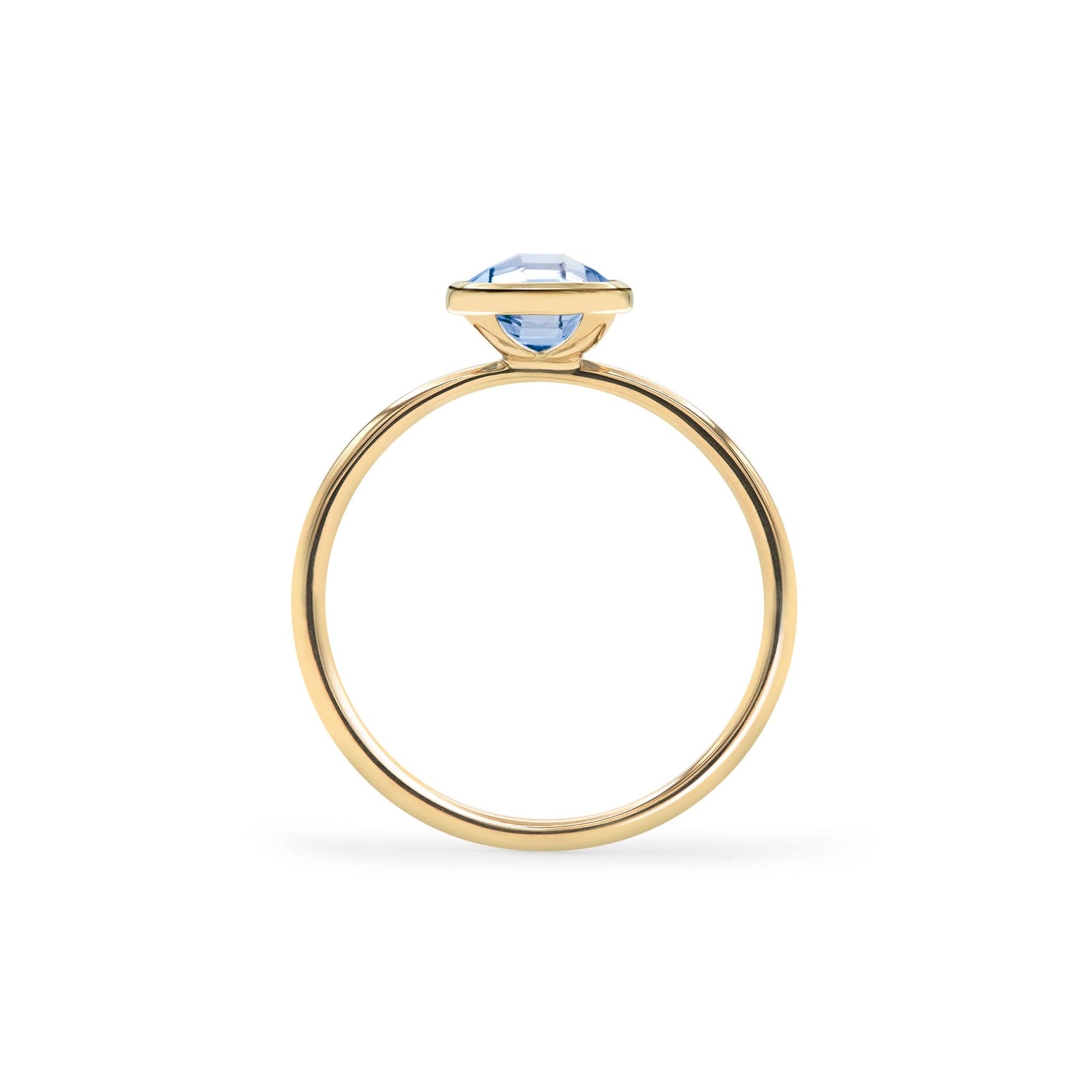1.6 mm wide 14k yellow gold Grand ring featuring one 6 mm briolette cut bezel set aquamarine - standing view